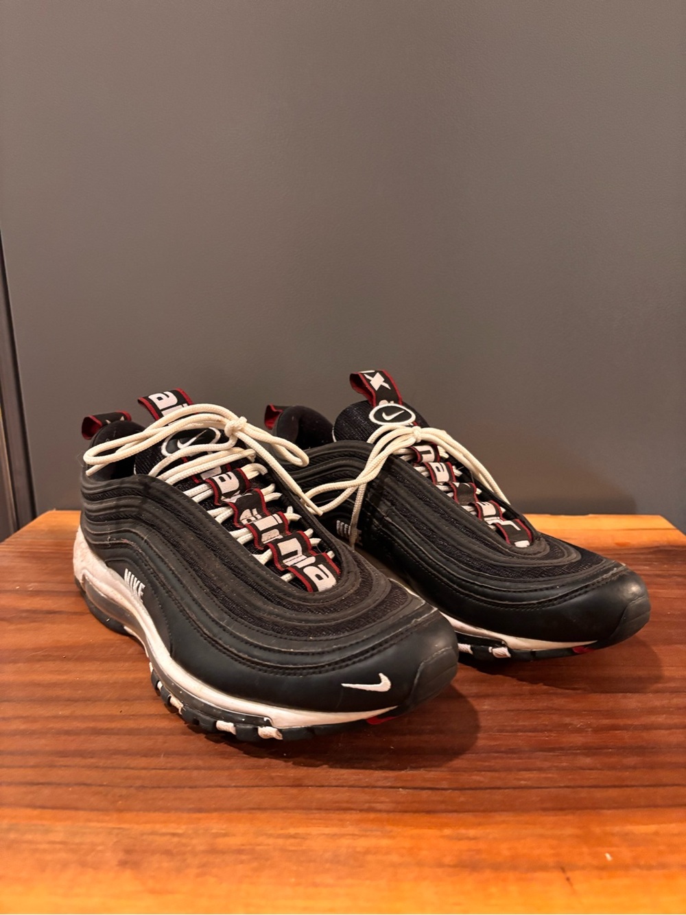 Nike Black Sneakers with White Laces and Red Accents
